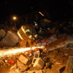 Firefighters cut into steel to get to students.