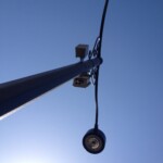 technomad loudspeakers installed on an outdoor light pole