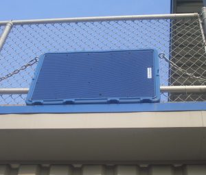 Technomad offers 14 custom colors that do not fade in sunlight. this photo shows two custom blue Berlin loudspeakers mounted to the press box at Middle Tennessee State University stadium.