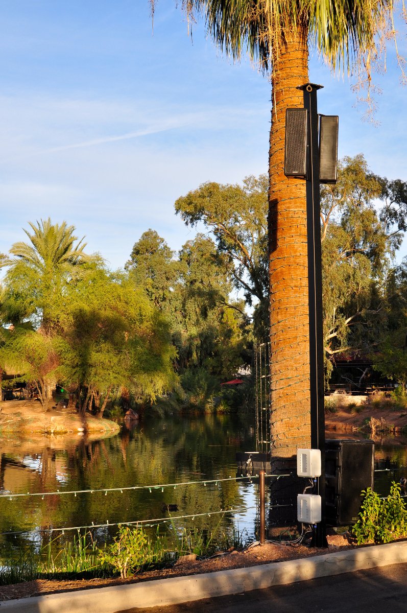 A series of custom-designed light poles surrounds the lagoon in the center of the zoo, each equipped with Technomad advanced audio systems